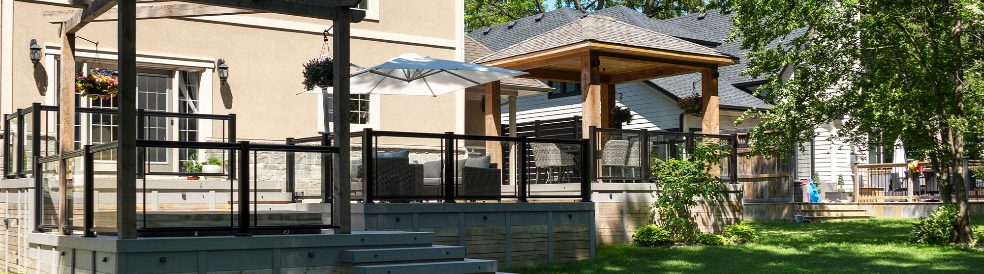 Composite deck project with a pergola, pavilion, and custom deck accessories.